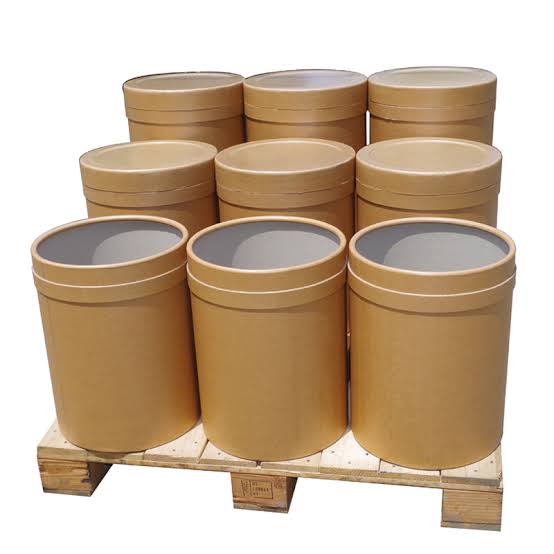 Export-packed drums and vacuum-sealed bags of graded Lakadong turmeric powder ready for shipment