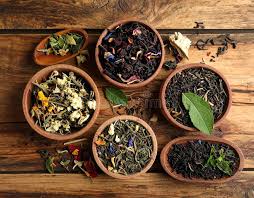 Dried herbal tea botanicals and tea bags arranged for private label packaging