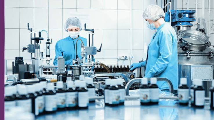 FDA compliance documentation and herbal ingredient samples in a US supplement manufacturing facility