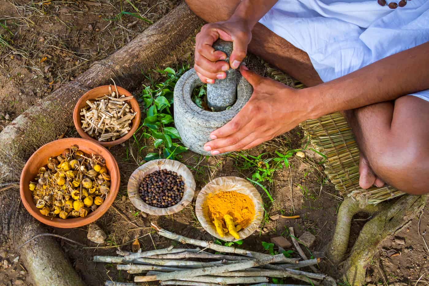 Traditional Ayurvedic preparation with mortar and pestle, Gujarat India